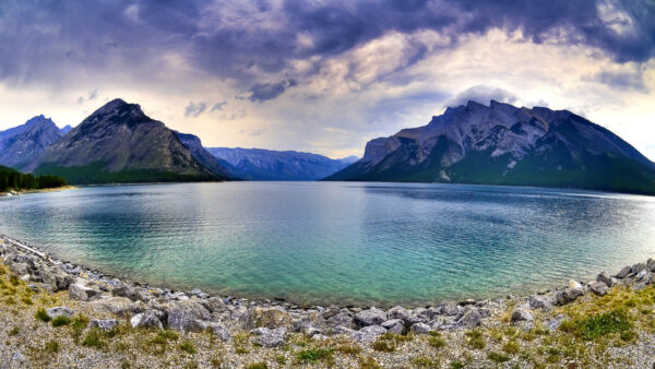 Wallpaper Under, Nature, Sky, Stones, River, Blue, And, Trees, Cloudy, Surrounded, Mountains