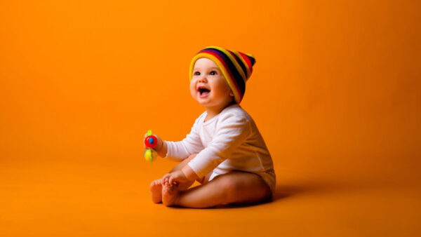 Wallpaper White, WALL, Toy, Cute, Multicolored, Sitting, Orange, Hat, Bodysuit, And, Holding, Boy, Smiling, Baby, Wearing, Background