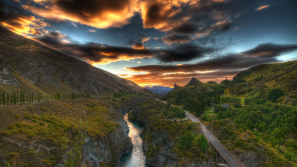 Wallpaper Dark, Green, Black, Trees, Under, Road, Cloudy, Covered, Between, Mountains, Yellow, Sky