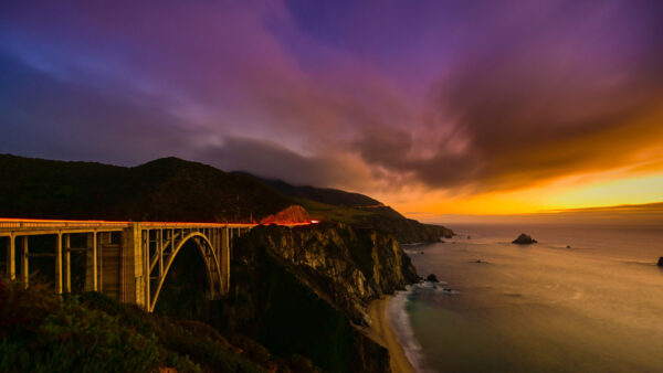 Wallpaper And, Bridge, Ocean, Between, Sky, Black, Rock, Under, Near, Purple, Yellow, Cloudy, Mountains, Nature